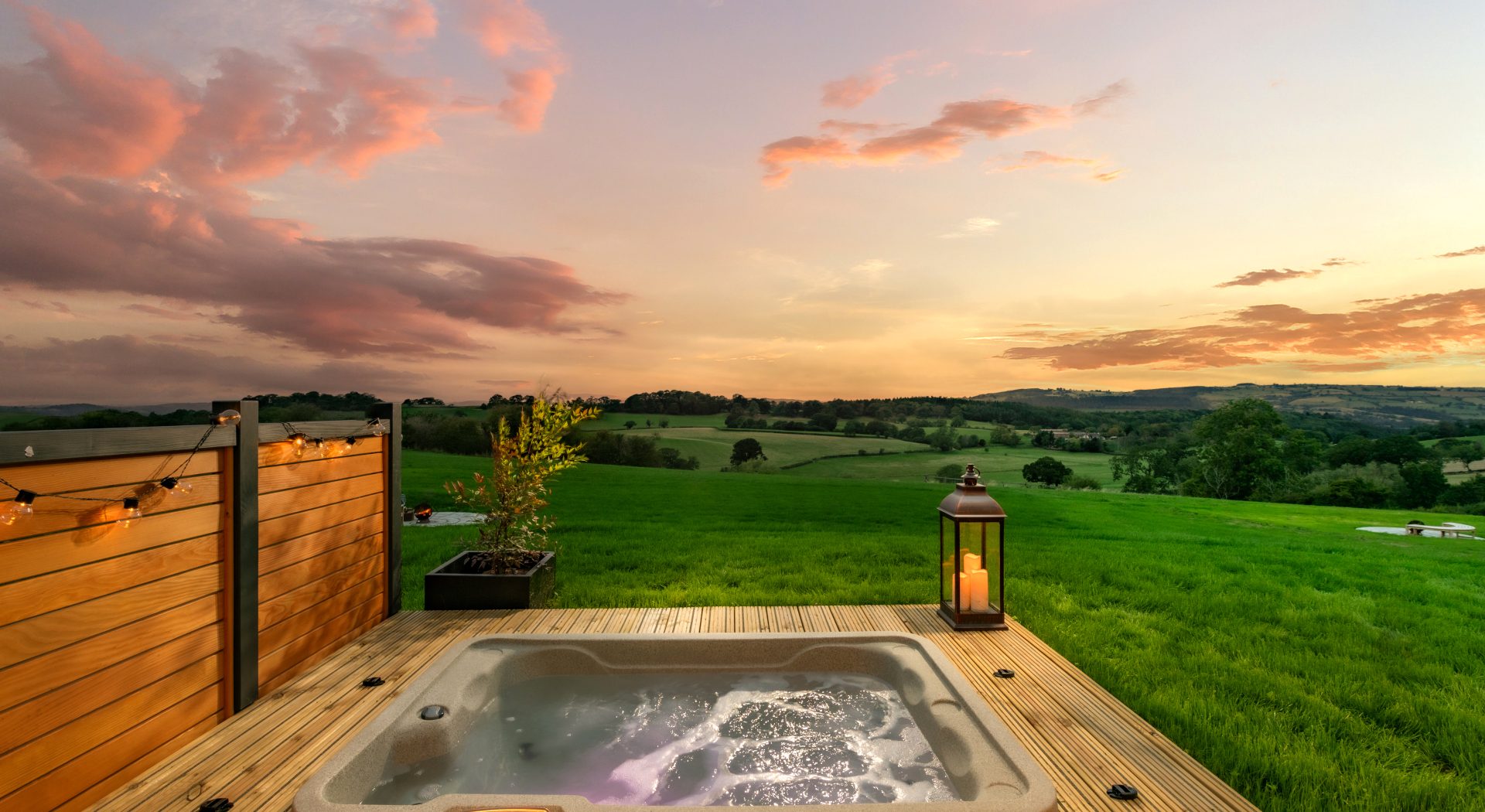 Hot tub with countryside sunset views at Kite Lodge